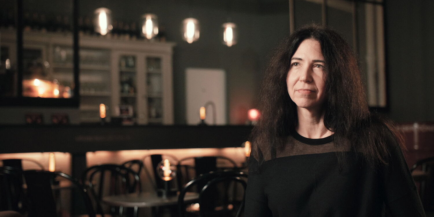 Close-up of an interviewee in the atmospheric setting of the club during the filming of the jazz documentary.