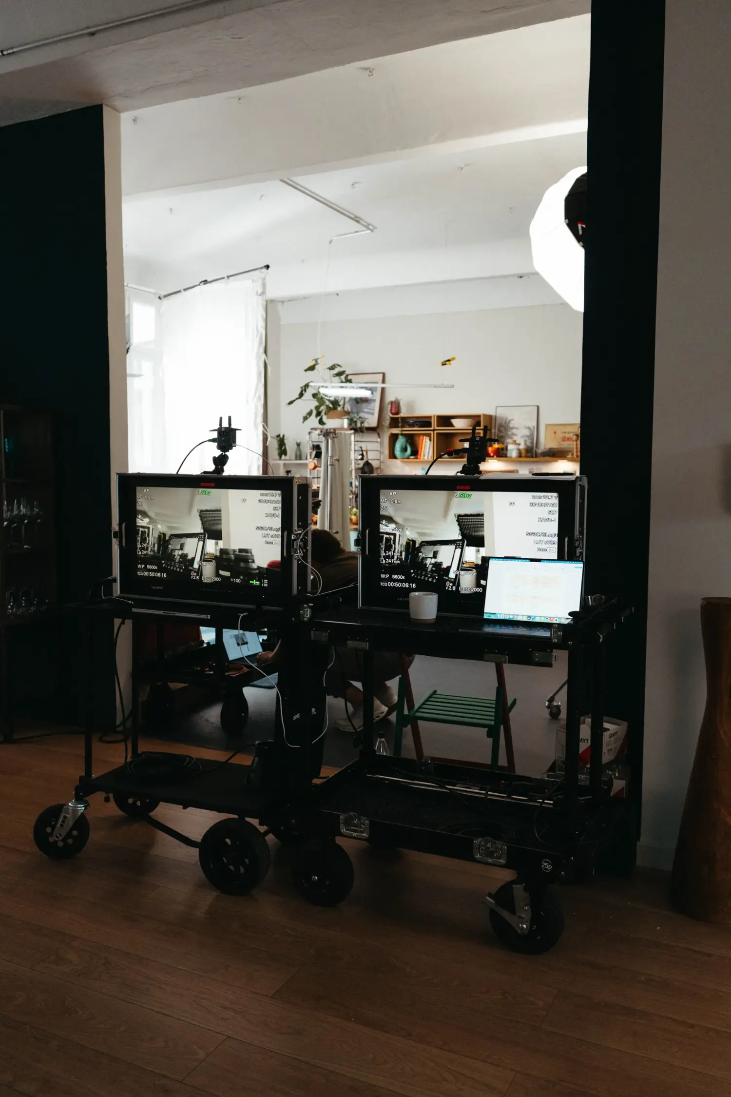 Professional video village setup on set: Two reference monitors on a Magliner cart displaying the current SONY FX6 camera feed.
