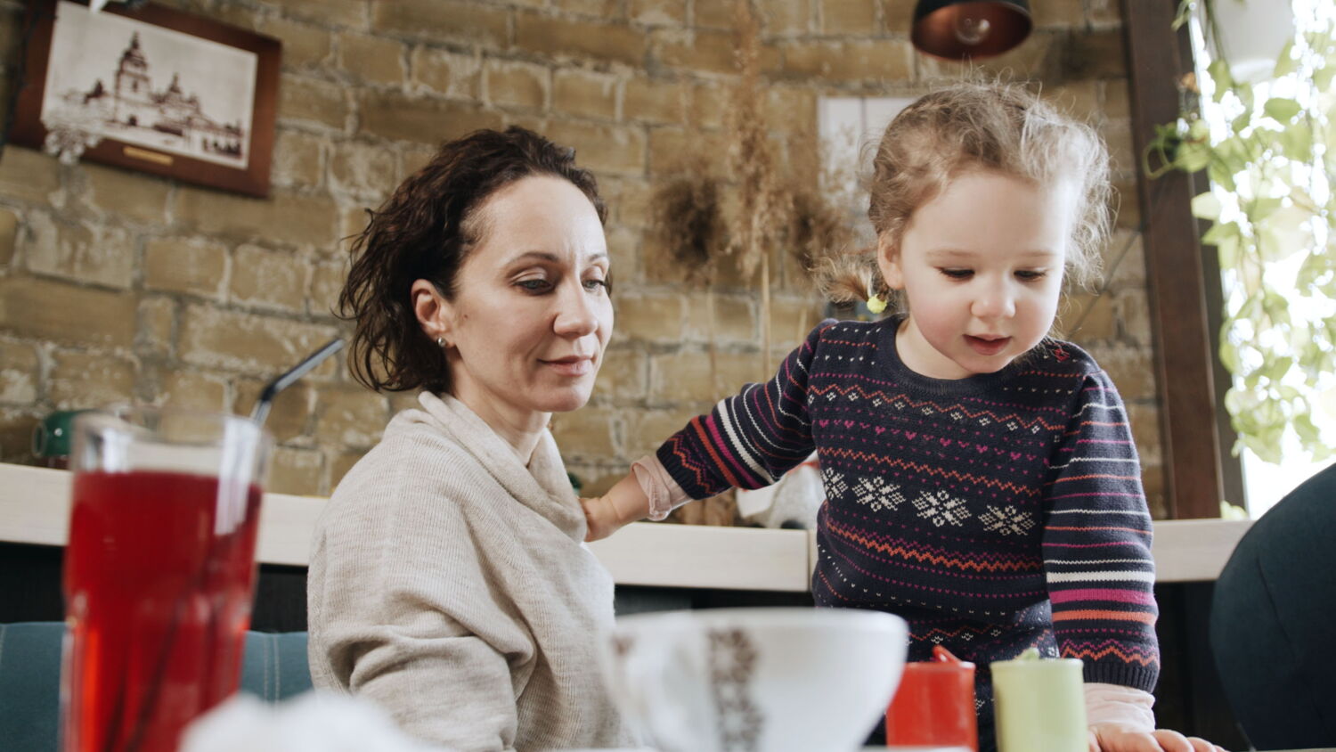 A personal moment between an activist and her daughter, highlighting the motivation to fight for a better future.